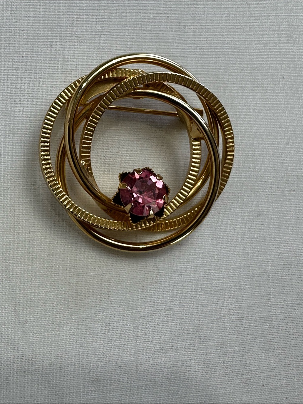 Gold-Tone Circle Brooch with Pink Stone Accent
